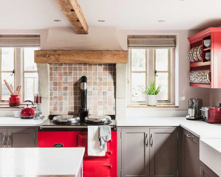 Beautifully design kitchen with blue cabinets on a freestanding kitchen island