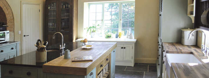 freestanding kitchen island with large bay windows
